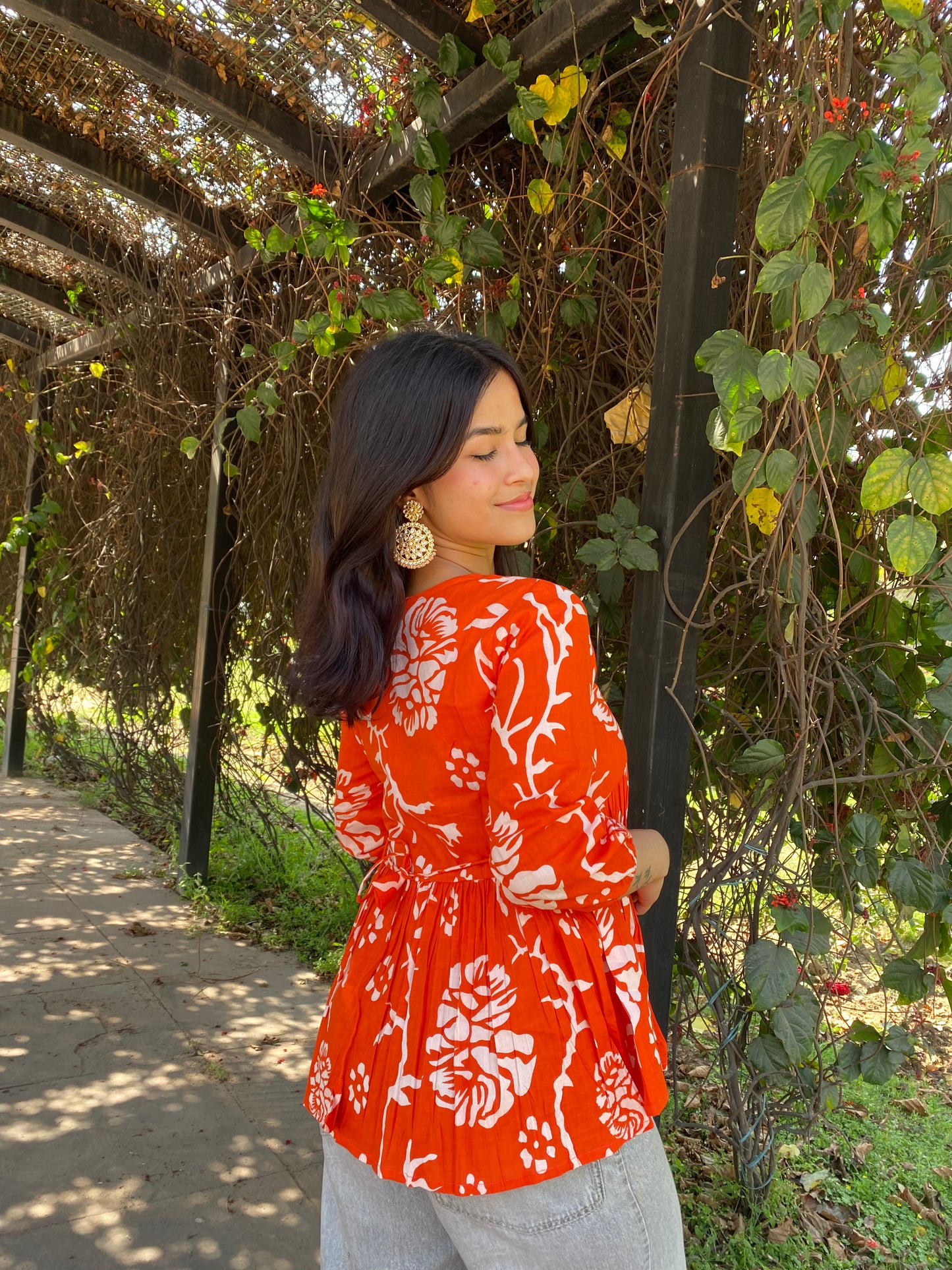 Orange peplum top