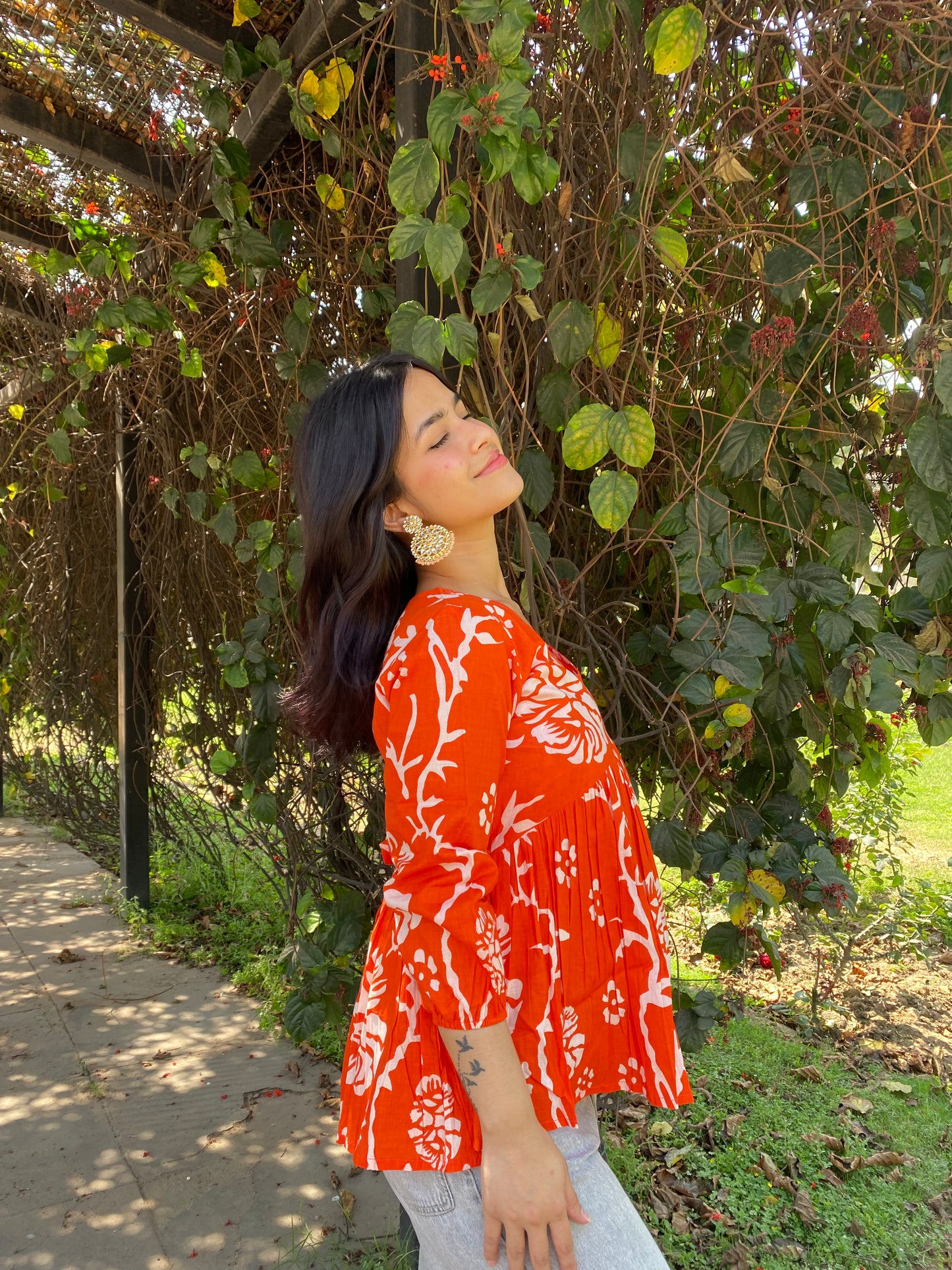 Orange peplum top