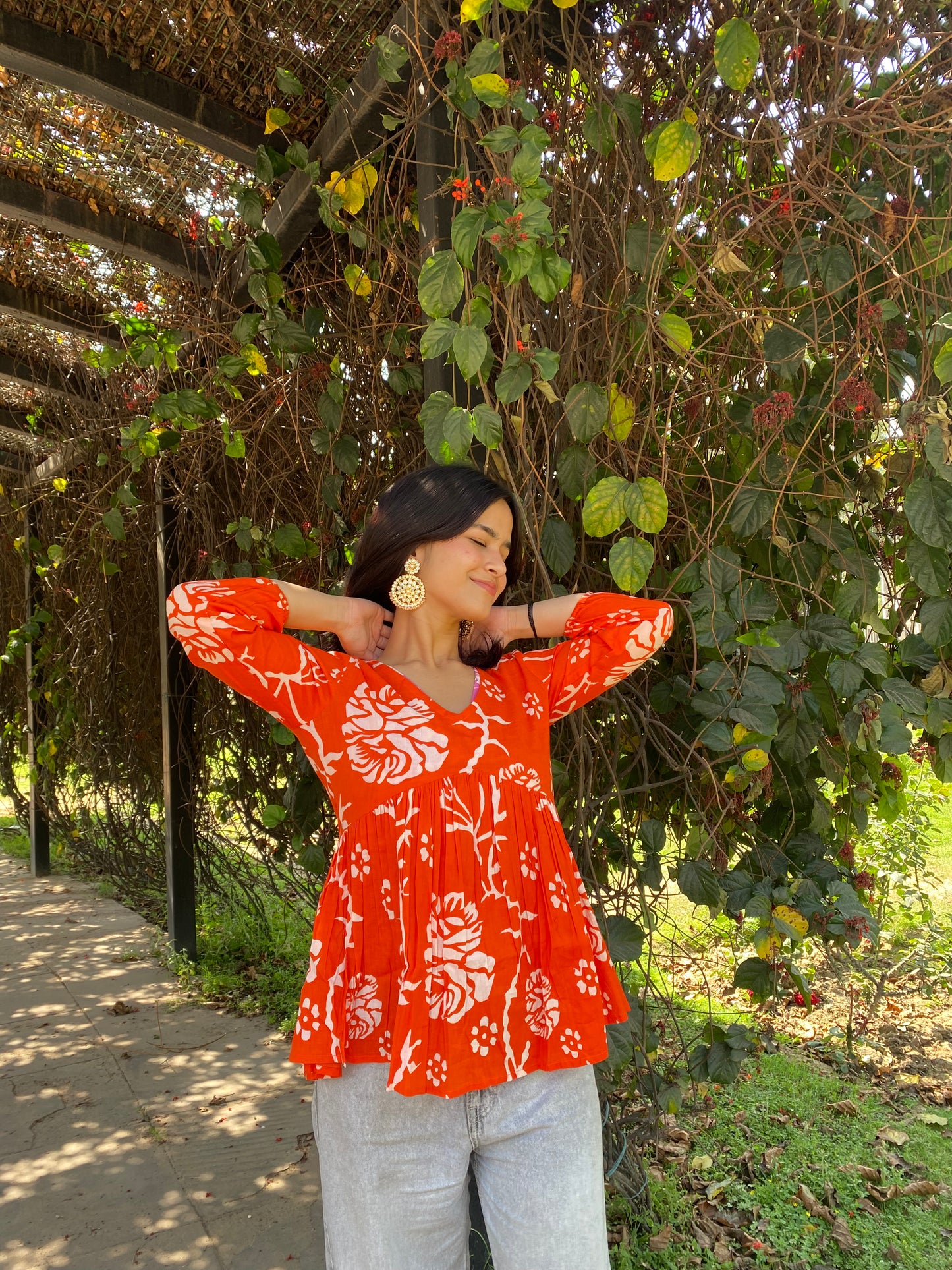 Orange peplum top