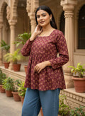 Plum Meadow Peplum Top