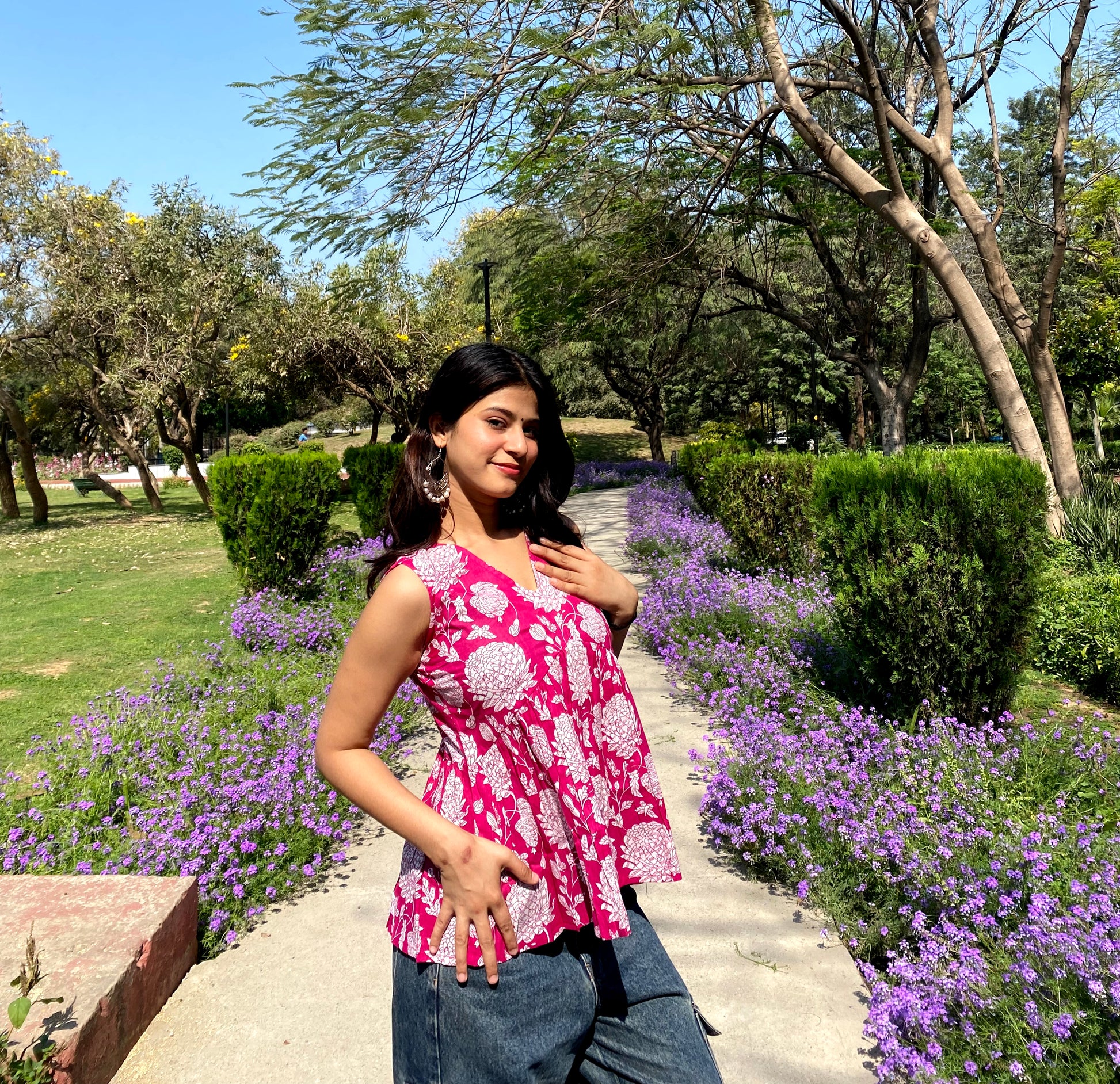 Pink sleeveless peplum top