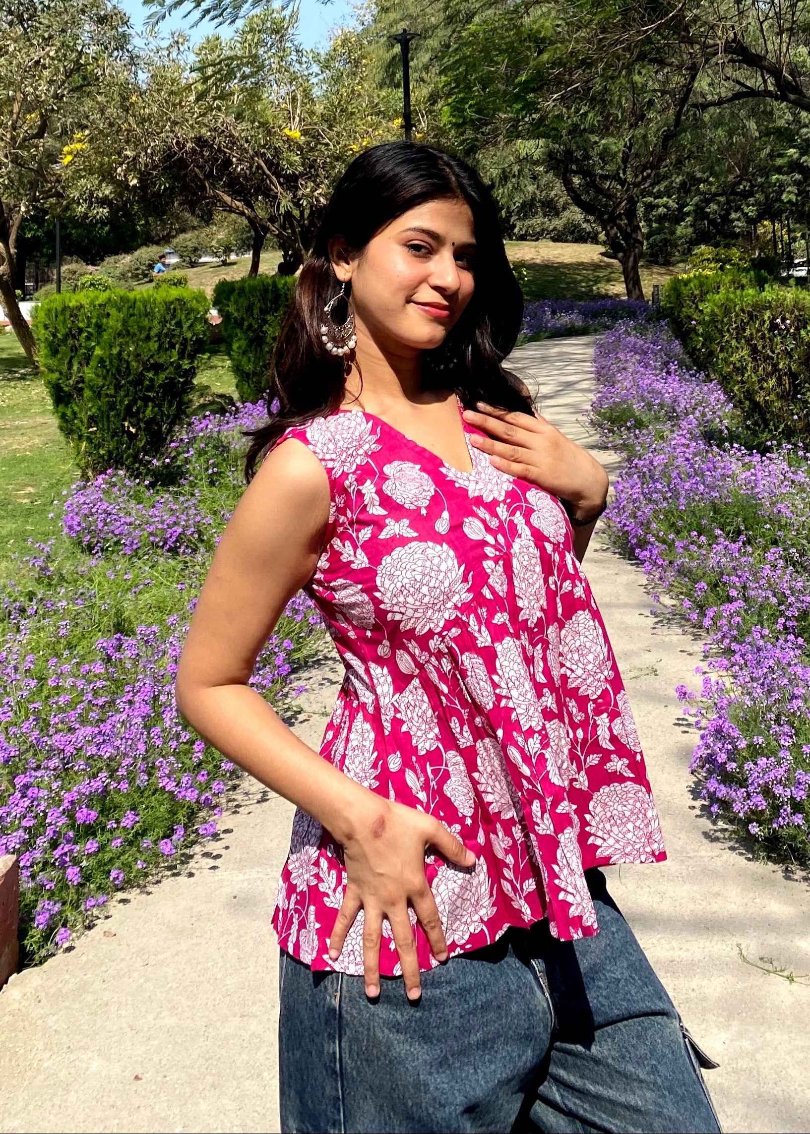 Pink sleeveless peplum top