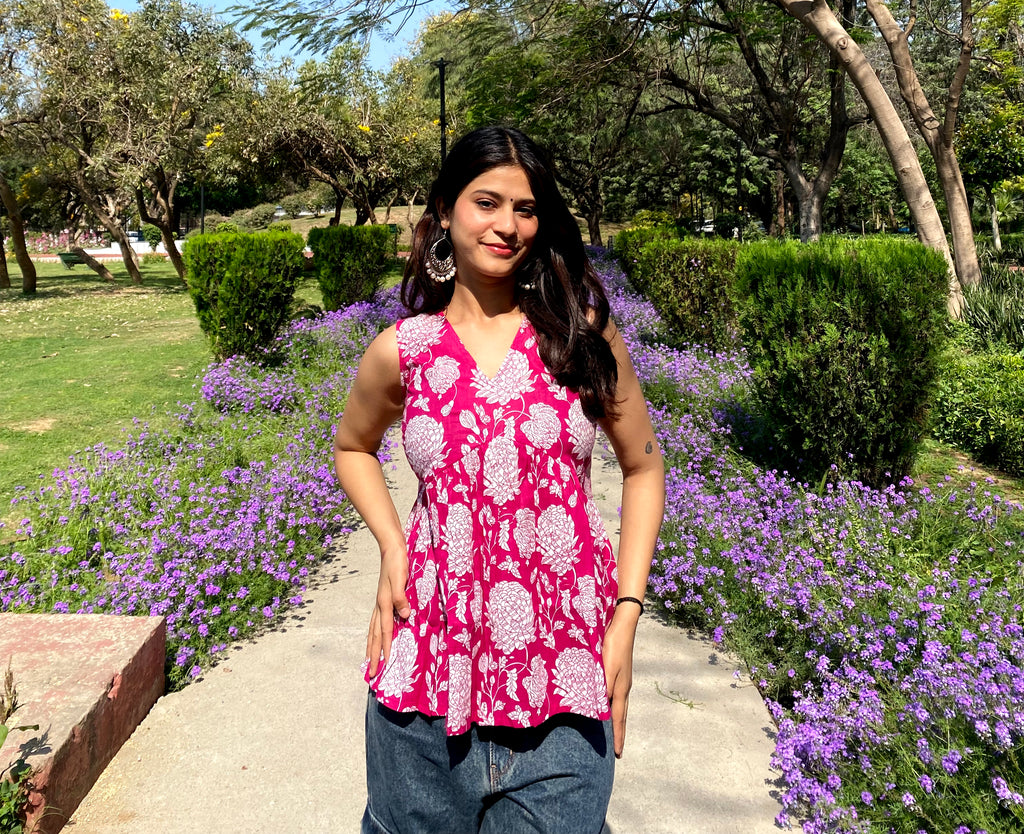 Pink sleeveless peplum top