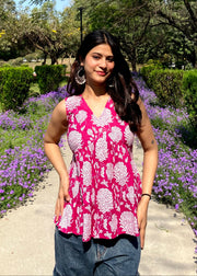Pink sleeveless peplum top