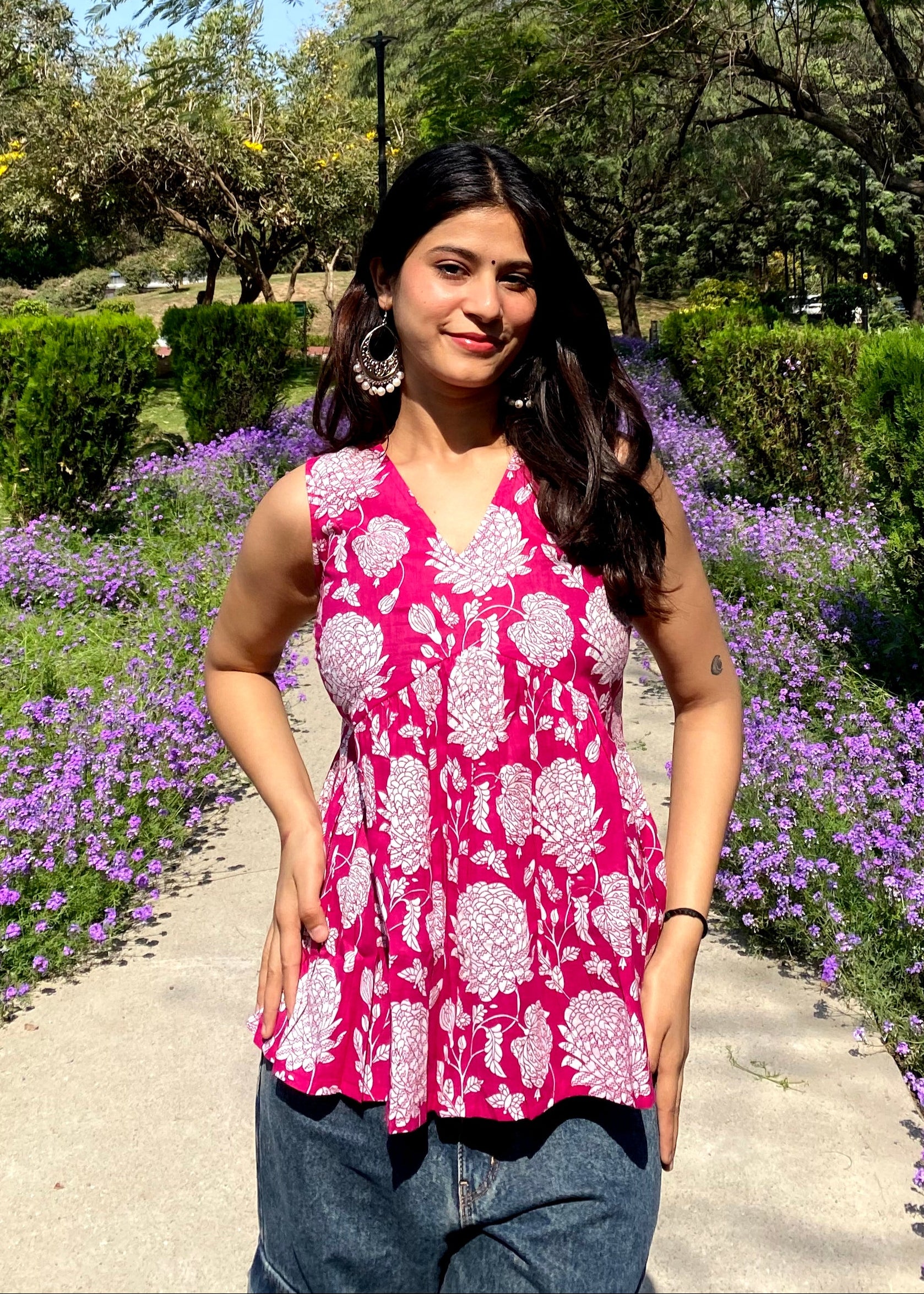 Pink sleeveless peplum top