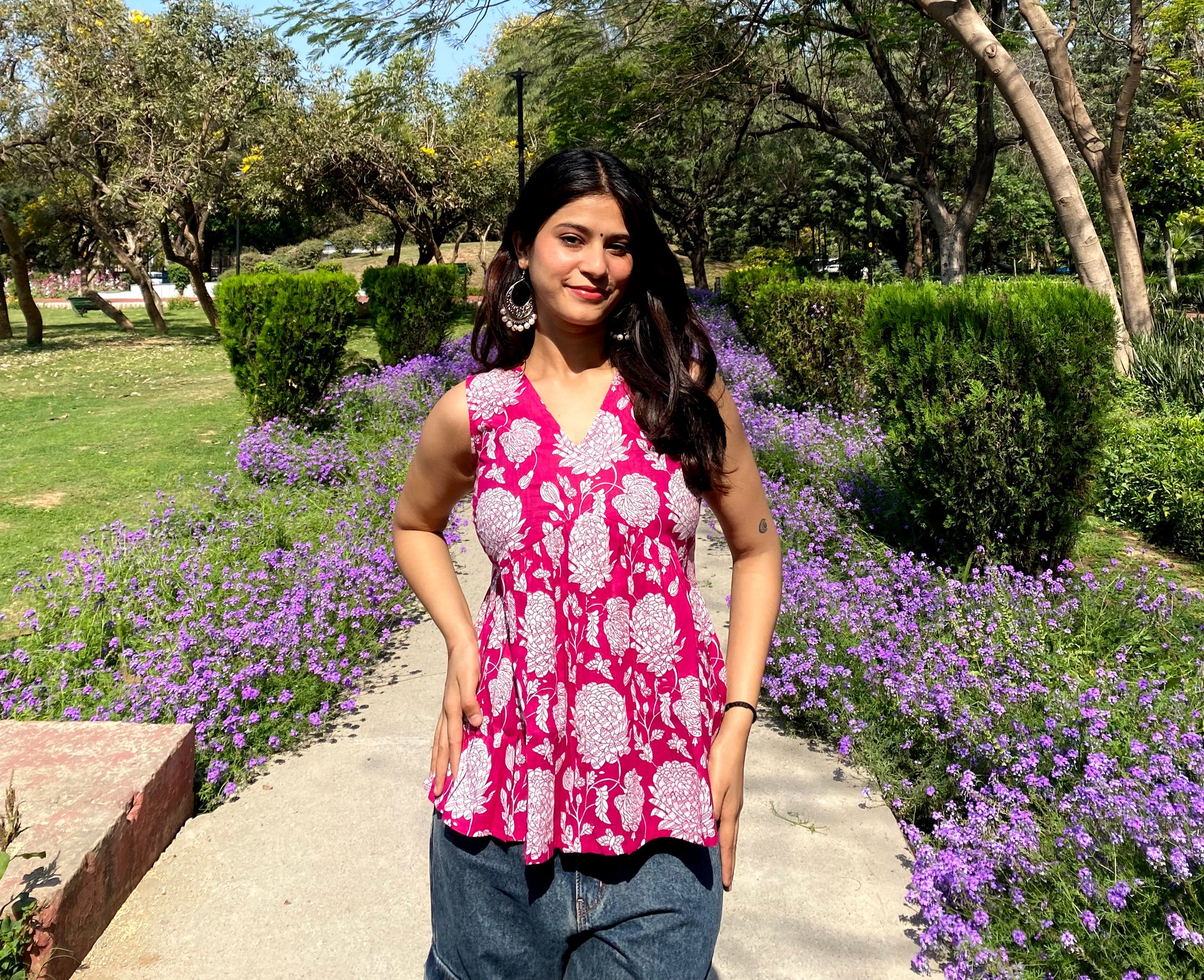 Pink sleeveless peplum top