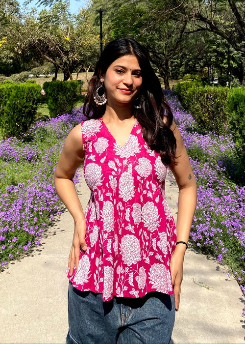 Pink sleeveless peplum top