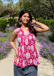 Pink sleeveless peplum top