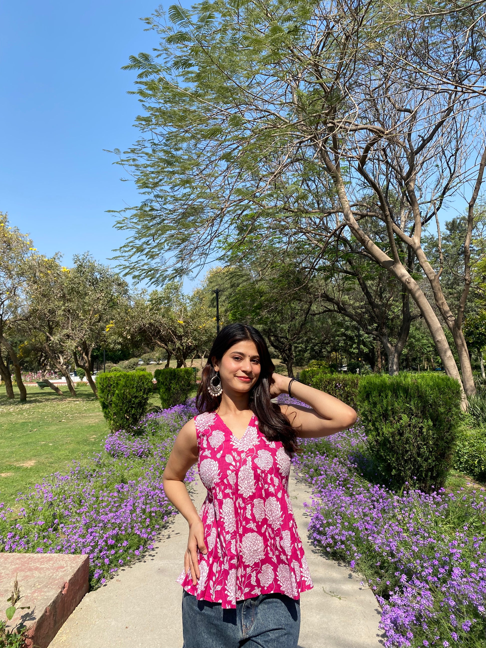 Pink sleeveless peplum top