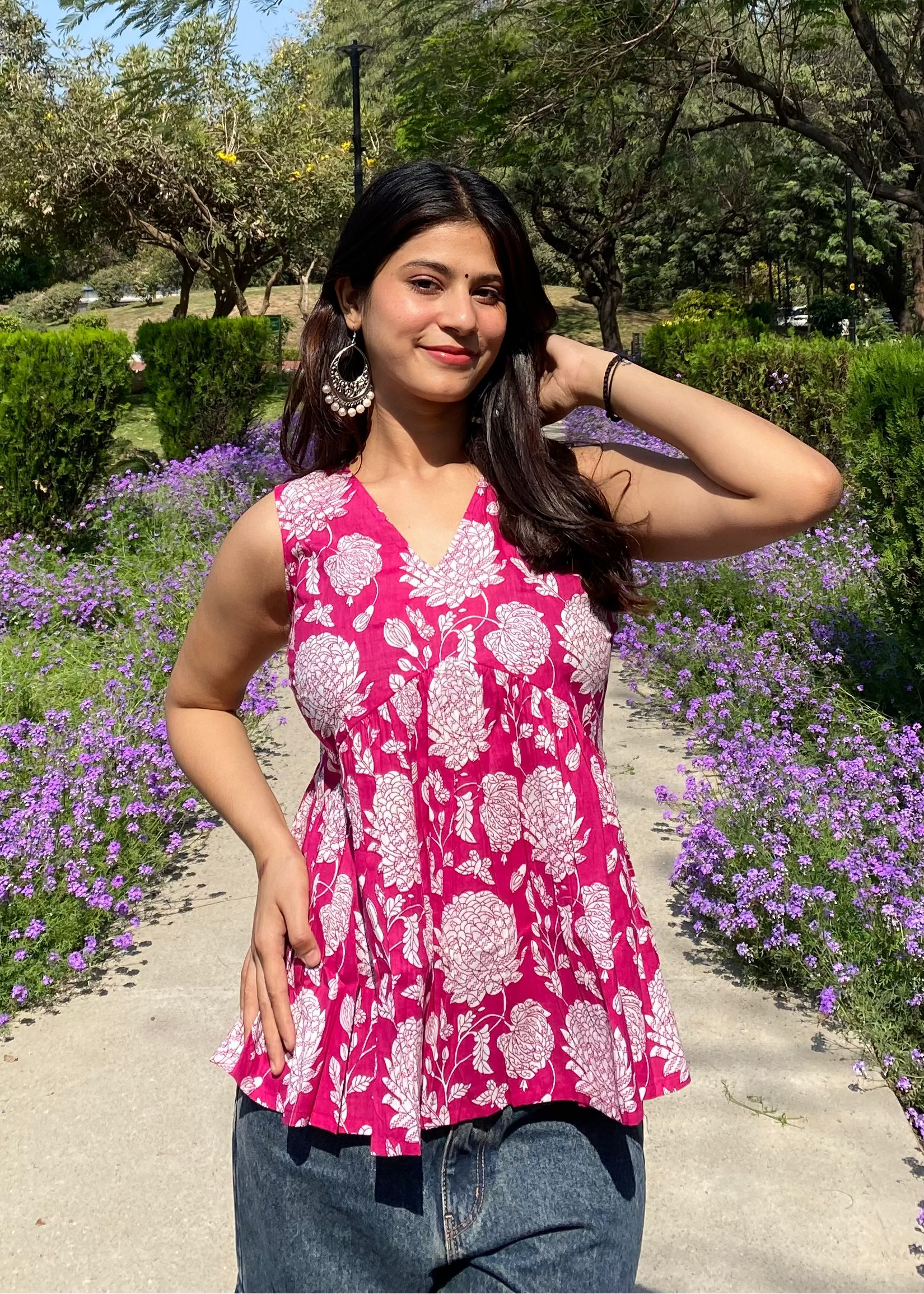 Pink sleeveless peplum top